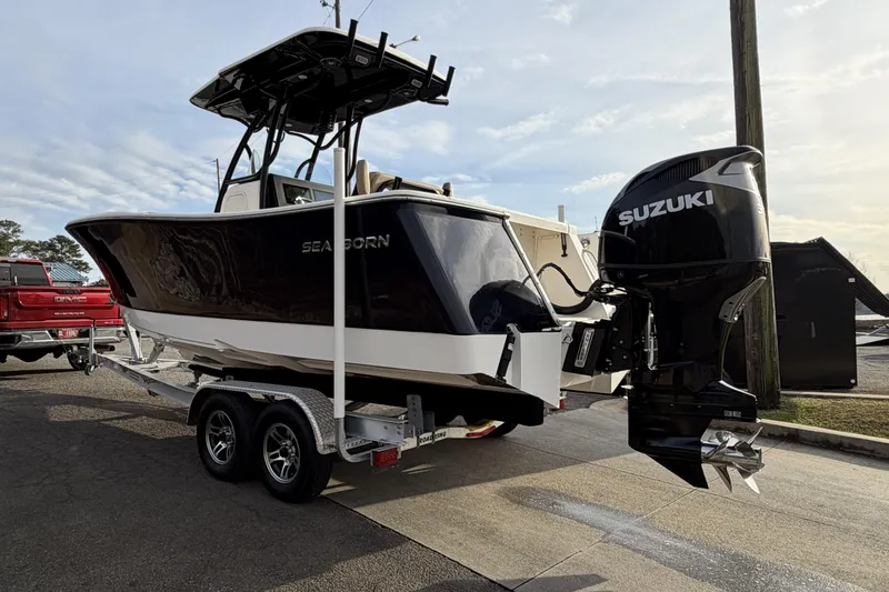 Slide: The Image of 2024 Sea Born SX239 Offshore boat with Suzuki outboard engine on trailer. - 3