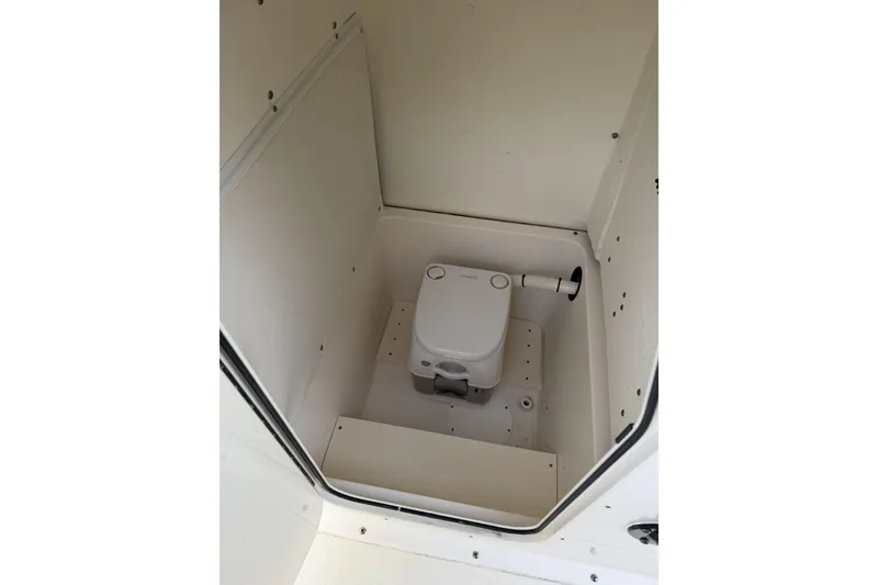 Slide: The Image of 2024 Sea Born SX239 Offshore boat interior with compact marine toilet. - 30