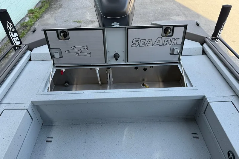 Slide: The Image of 2026 SeaArk EasyCat boat with open storage compartments on deck. - 10