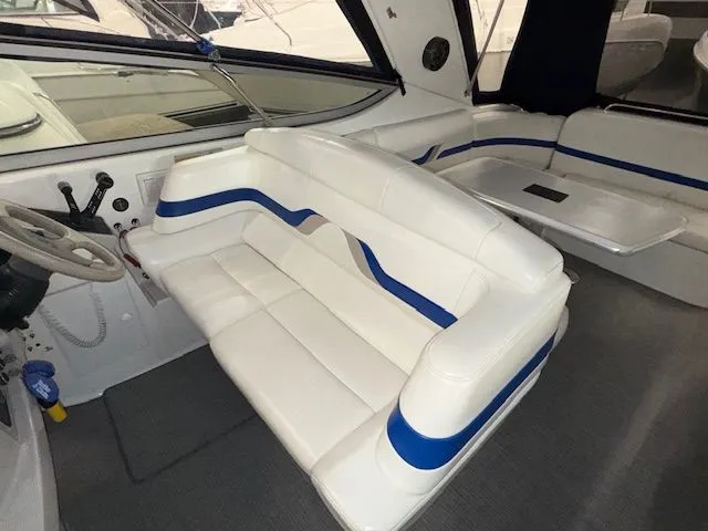 Slide: The Image of Interior of a 2001 Formula 370 Super Sport boat with white seating. - 10