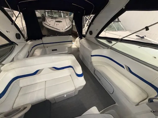 Slide: The Image of Interior of a 2001 Formula 370 Super Sport yacht with white seating. - 11