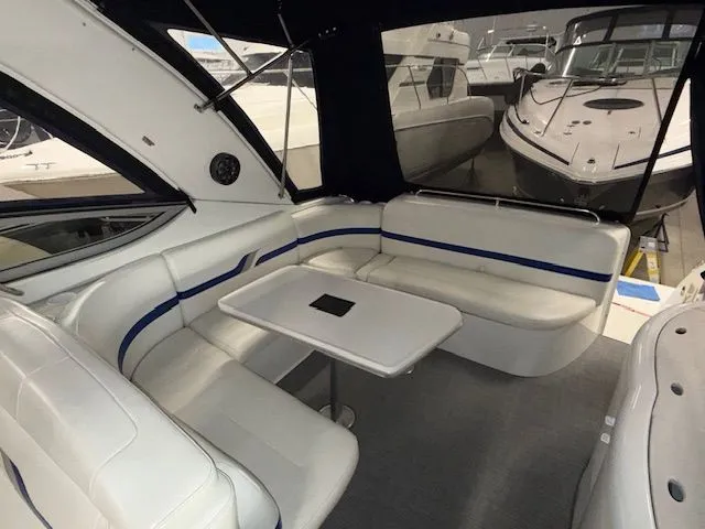 Slide: The Image of Interior of a 2001 Formula 370 Super Sport yacht with white seating area. - 12