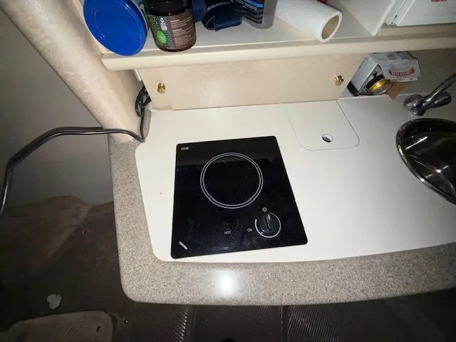 Slide: The Image of Galley area in a 2001 Formula 370 Super Sport boat. - 19