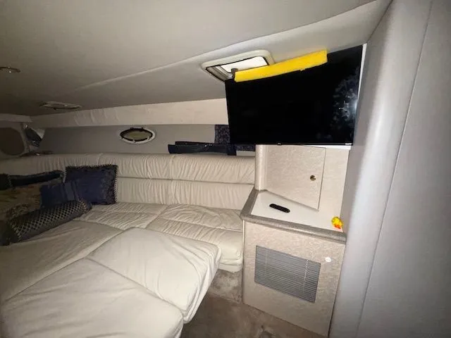 Slide: The Image of Interior of a 2001 Formula 370 Super Sport yacht with sofa and TV. - 20