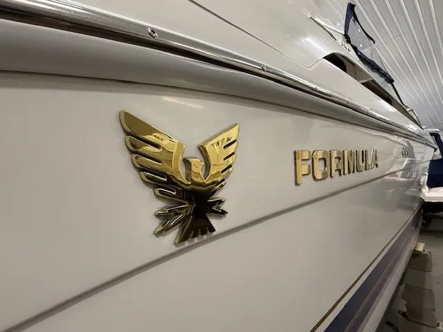 Slide: The Image of Close-up of 2001 Formula 370 Super Sport boat with gold emblem. - 6
