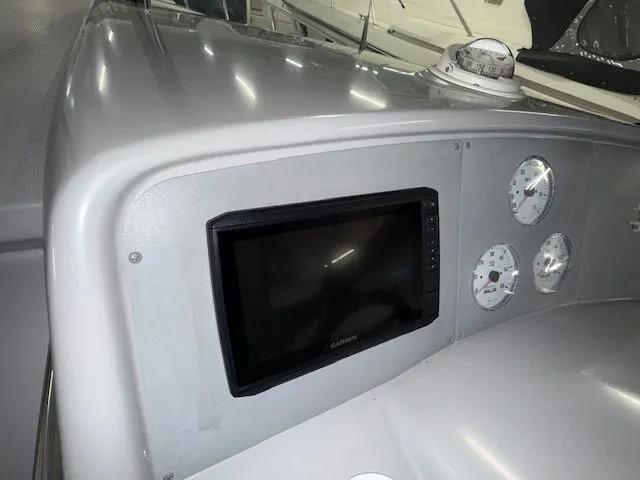 Slide: The Image of Dashboard of a 2001 Formula 370 Super Sport boat with Garmin display. - 8