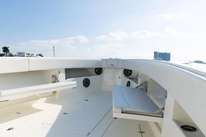 Slide: The Image of 2020 SeaVee 390Z boat interior with seating and speakers under a clear sky. - 10
