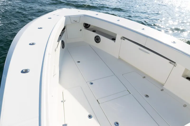 Slide: The Image of 2020 SeaVee 390Z boat deck, spacious and sleek design on open water. - 16