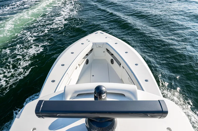 Slide: The Image of 2020 SeaVee 390Z boat cruising on open water, showcasing sleek design and spacious deck. - 18