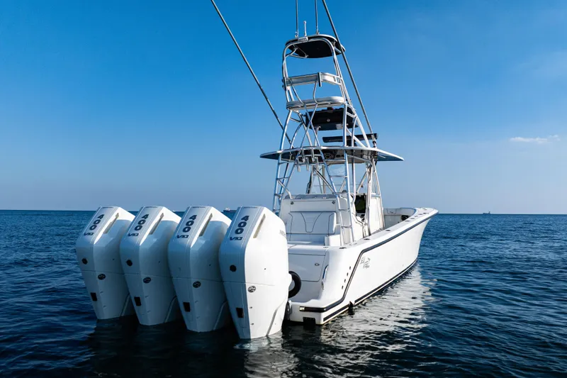 Slide: The Image of 2020 SeaVee 390Z boat on calm ocean water under clear blue sky. - 2