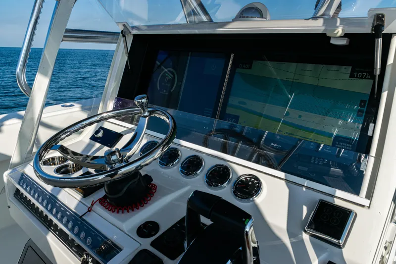 Slide: The Image of 2020 SeaVee 390Z boat helm with advanced navigation system and ocean view. - 25