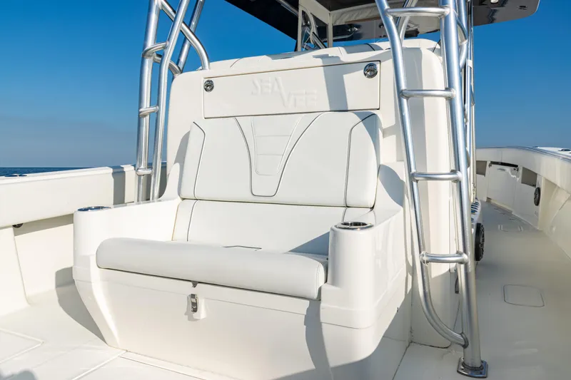 Slide: The Image of 2020 SeaVee 390Z boat interior with white seating and stainless steel ladder. - 30