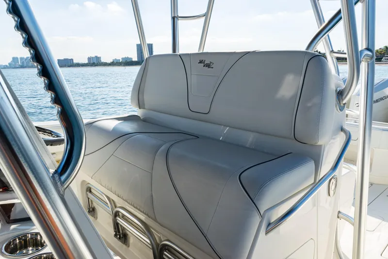 Slide: The Image of 2020 SeaVee 390Z boat seating with ocean view and city skyline in background. - 33