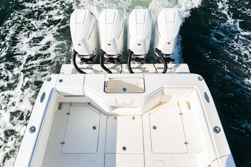 Slide: The Image of 2020 SeaVee 390Z boat with four powerful outboard engines on the water. - 35