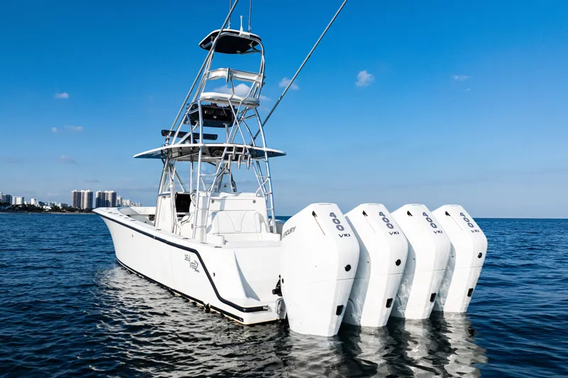 Slide: The Image of 2020 SeaVee 390Z boat with four outboard engines on open water. - 4