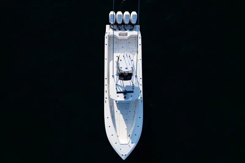Slide: The Image of Top view of 2020 SeaVee 390Z boat with four engines on dark water. - 44