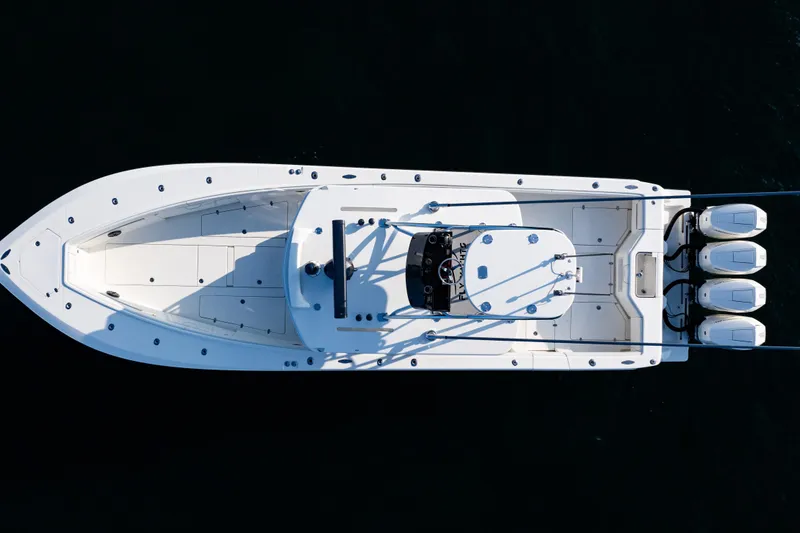 Slide: The Image of Aerial view of 2020 SeaVee 390Z boat with triple outboard engines. - 45