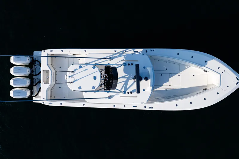 Slide: The Image of Aerial view of 2020 SeaVee 390Z boat with triple outboard engines. - 46