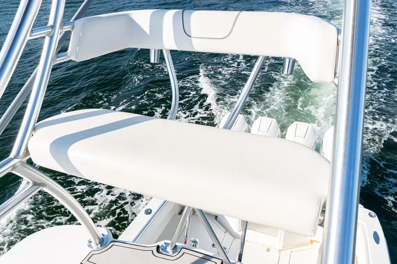 Slide: The Image of 2020 SeaVee 390Z boat with white seating and ocean backdrop. - 48