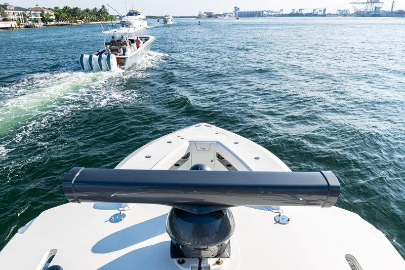 Slide: The Image of 2020 SeaVee 390Z boat cruising on open water with multiple engines. - 49