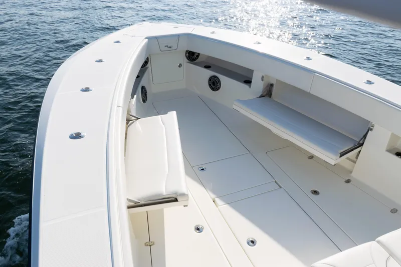 Slide: The Image of 2020 SeaVee 390Z boat deck with seating, on calm water. - 8