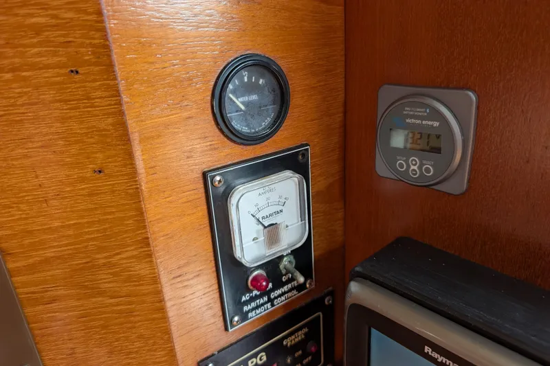 Slide: The Image of Control panel of 1988 Island Packet 38 sailboat with gauges and meters. - 21