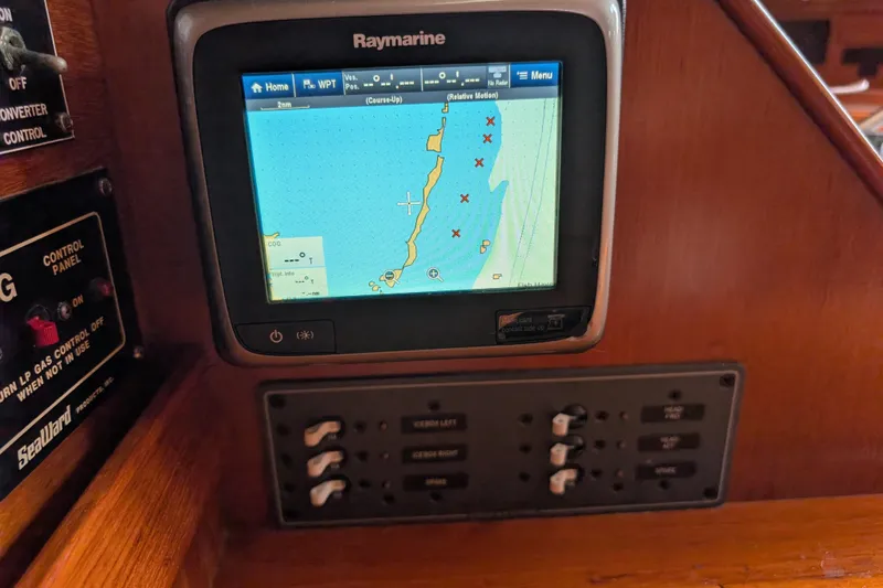 Slide: The Image of Raymarine navigation system on 1988 Island Packet 38 sailboat, displaying nautical chart. - 23