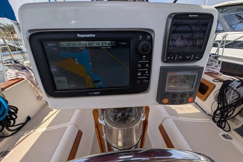Slide: The Image of Cockpit navigation system on 1988 Island Packet 38 sailboat, featuring Raymarine displays. - 29
