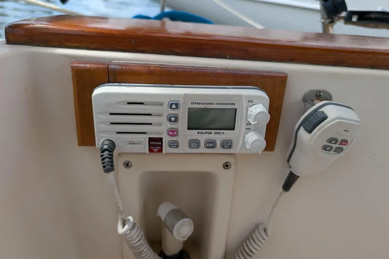 Slide: The Image of VHF radio on 1988 Island Packet 38 sailboat, featuring Standard Horizon Eclipse DSC+ model. - 32