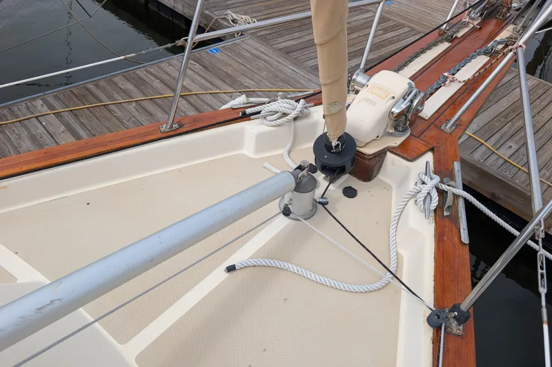 Slide: The Image of 1988 Island Packet 38 sailboat deck with rigging and dock view. - 33