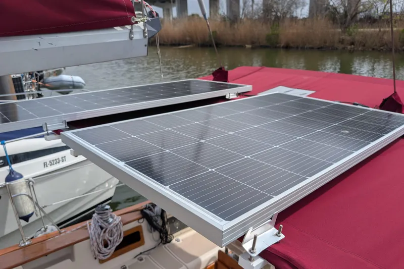 Slide: The Image of Solar panels on 1988 Island Packet 38 sailboat with red canvas cover. - 41