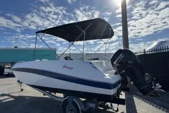 Slide: The Image of 2022 Hurricane SunDeck Sport 192 RL OB boat with canopy and outboard motor. - 3