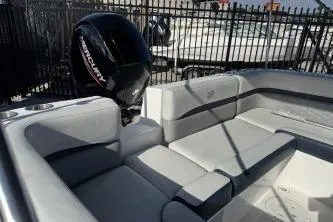 Slide: The Image of 2022 Hurricane SunDeck Sport 192 RL OB boat interior with Mercury outboard engine. - 7