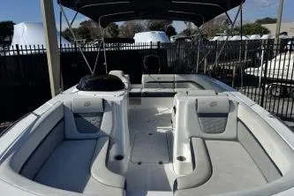 Slide: The Image of 2022 Hurricane SunDeck Sport 192 RL OB boat with spacious seating and canopy. - 9