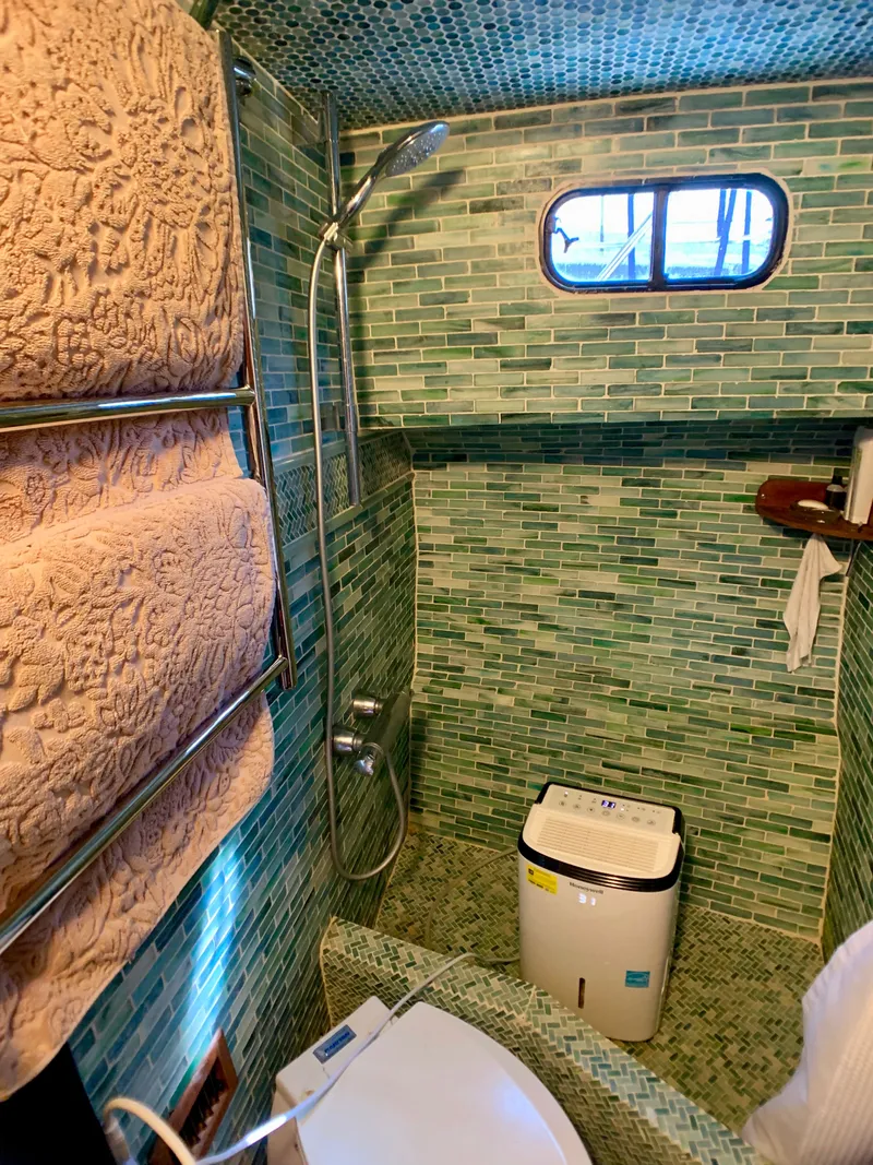 Slide: The Image of Green tiled bathroom in 1988 Harbor Master 520 Coastal yacht. - 31