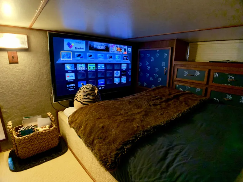 Slide: The Image of Cozy bedroom on a 1988 Harbor Master 520 Coastal boat. - 32