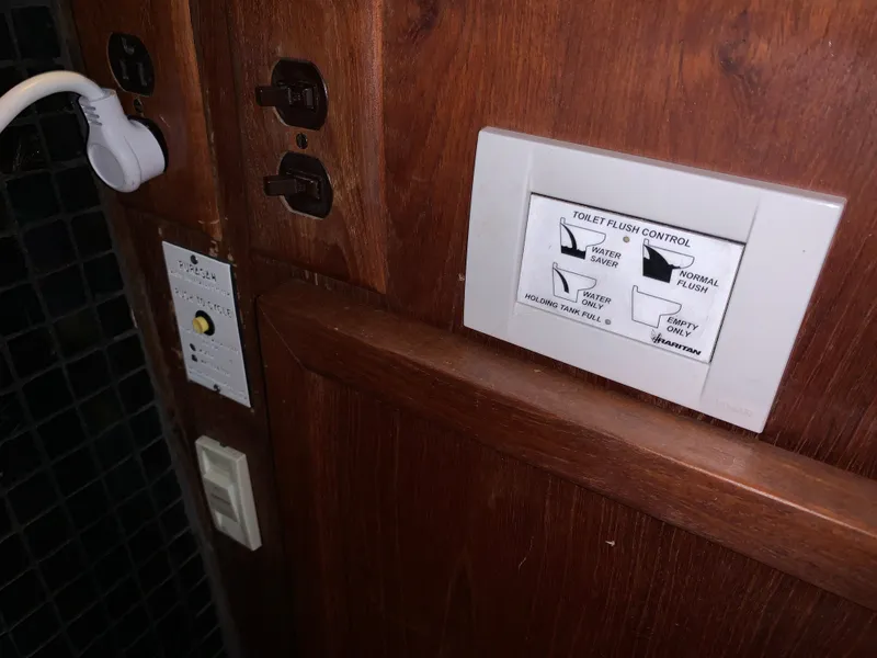 Slide: The Image of Toilet flush control on a 1988 Harbor Master 520 Coastal boat. - 38