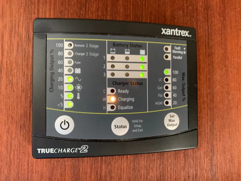 Slide: The Image of Xantrex TrueCharge2 charger on wood surface, 1988 Harbor Master 520 Coastal. - 39