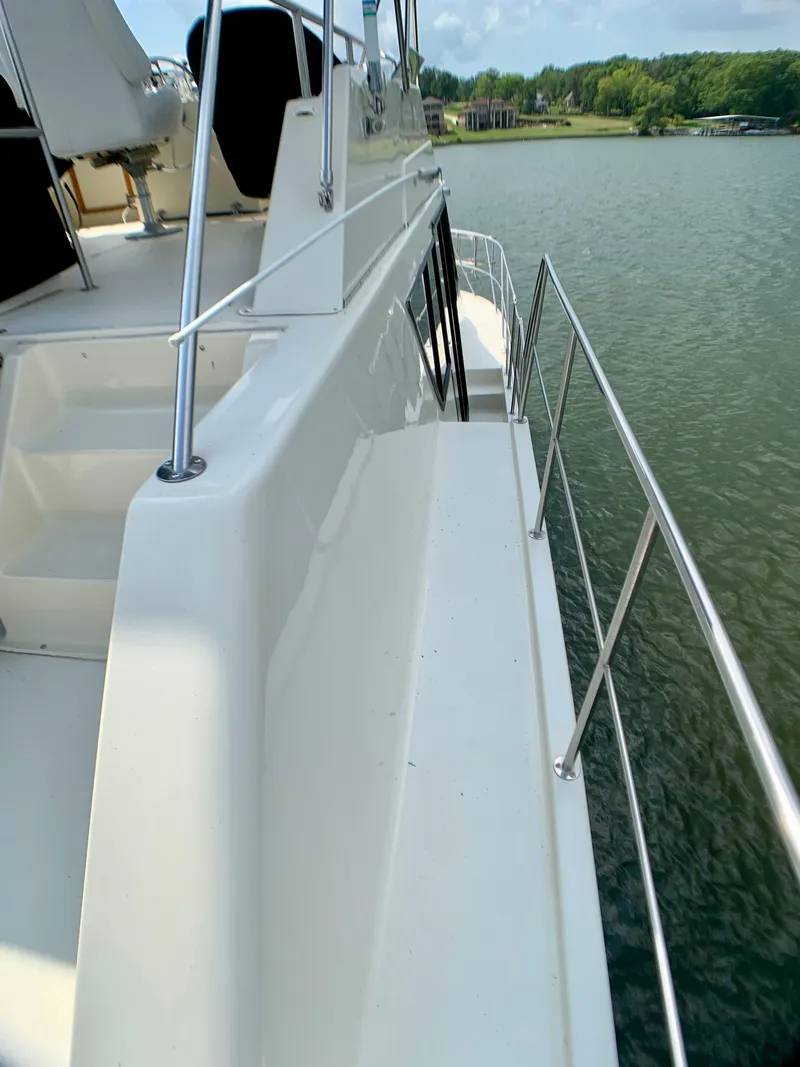 Slide: The Image of 1988 Harbor Master 520 Coastal on a serene lake. - 44