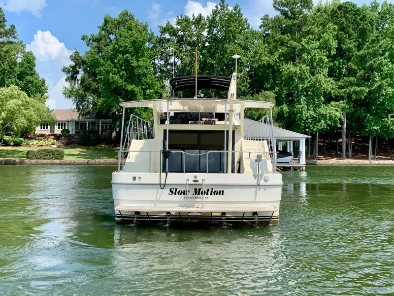 Slide: The Image of 1988 Harbor Master 520 Coastal on a serene lake. - 5