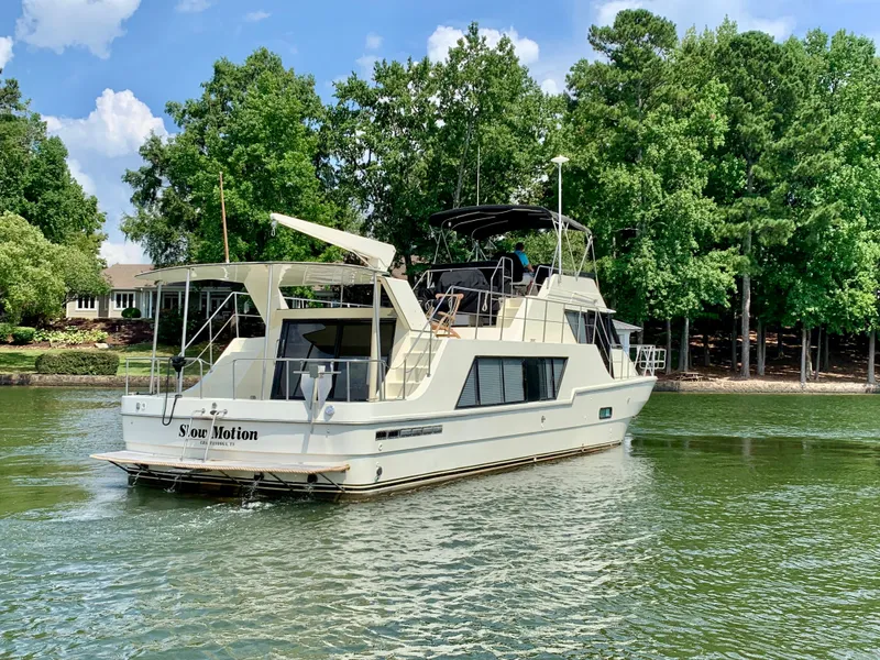 Slide: The Image of 1988 Harbor Master 520 Coastal yacht on a serene lake. - 6