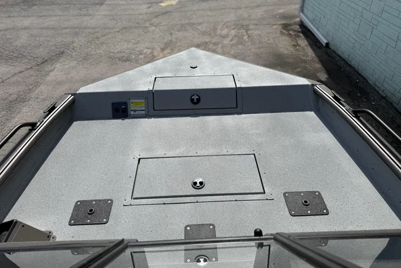 Slide: The Image of 2026 SeaArk Protege 200 boat deck with storage compartments and durable surface. - 7