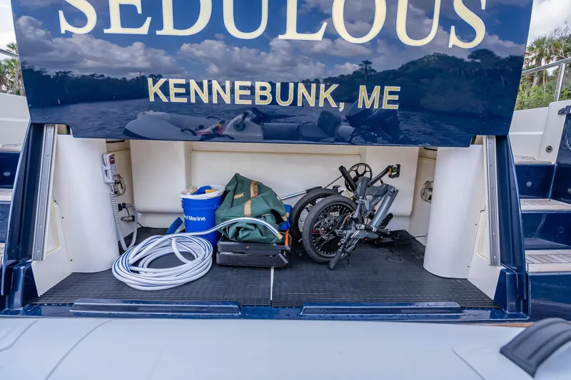 Slide: The Image of Storage compartment of 2025 Sabre 58 Salon Express yacht with equipment and folded bike. - 11