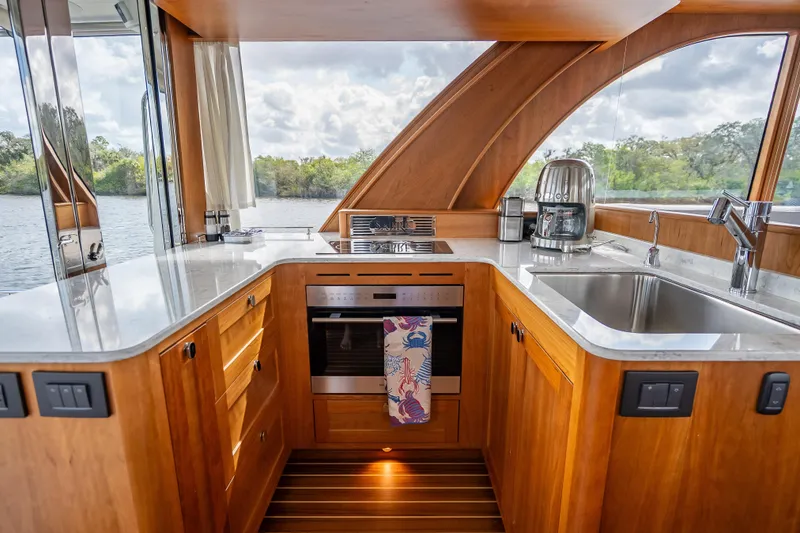 Slide: The Image of Luxurious kitchen interior of 2025 Sabre 58 Salon Express yacht with modern appliances. - 21