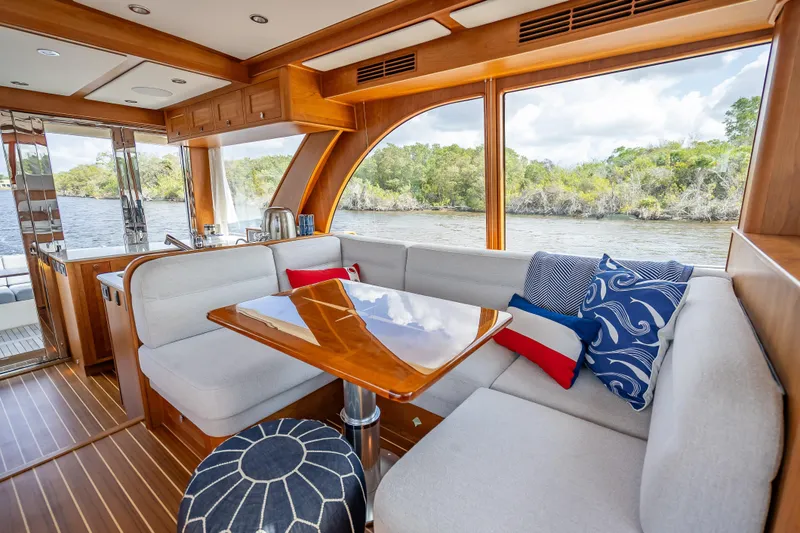 Slide: The Image of Luxurious interior of 2025 Sabre 58 Salon Express yacht with elegant seating and scenic views. - 25