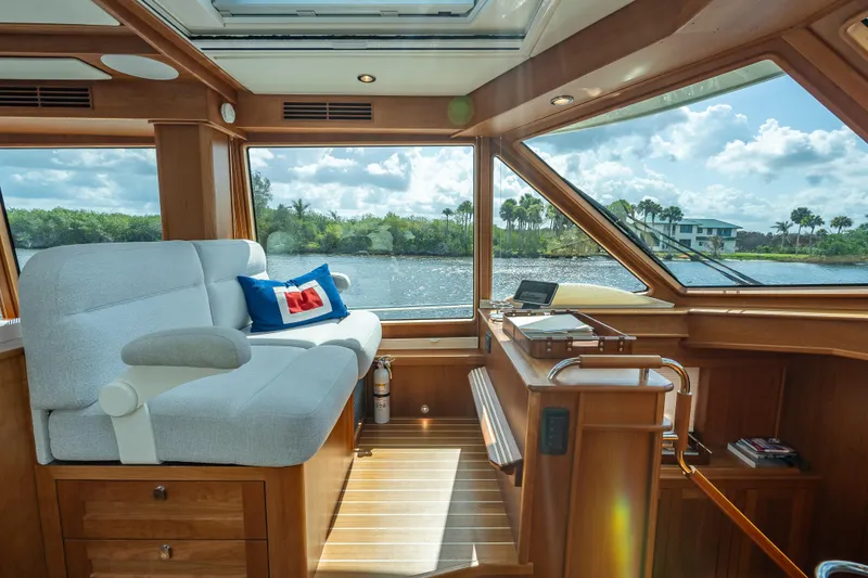 Slide: The Image of Luxurious interior of 2025 Sabre 58 Salon Express yacht with scenic water view. - 31