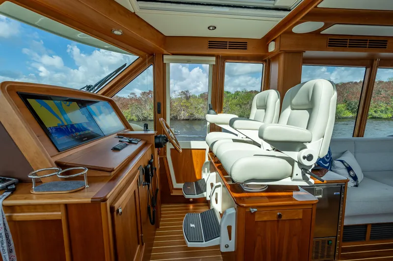 Slide: The Image of Interior of 2025 Sabre 58 Salon Express yacht with helm and luxurious seating. - 33