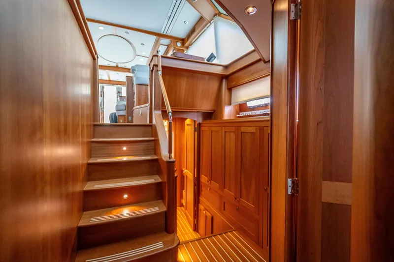Slide: The Image of Luxurious interior of 2025 Sabre 58 Salon Express yacht with wooden staircase and cabinetry. - 38