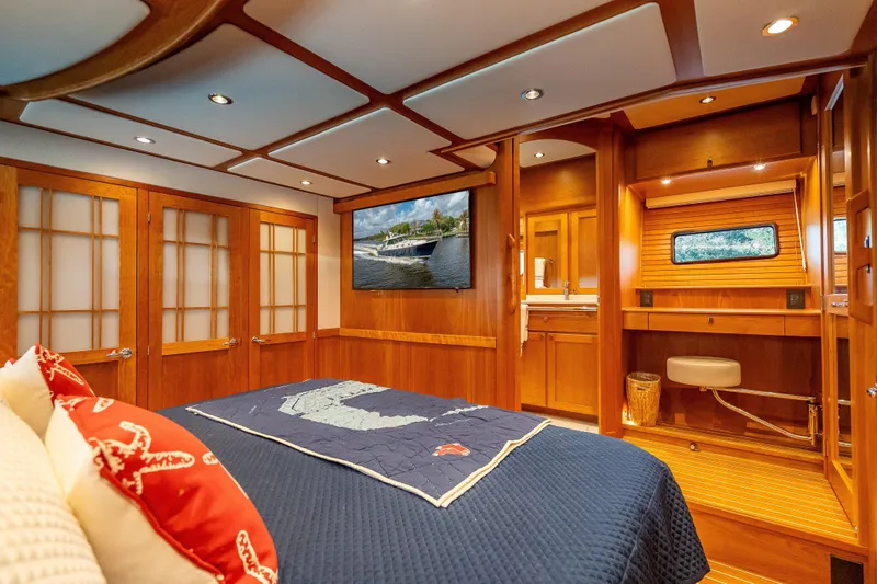 Slide: The Image of Luxurious 2025 Sabre 58 Salon Express cabin with elegant wood interior and modern amenities. - 42