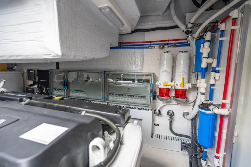 Slide: The Image of Engine room of 2025 Sabre 58 Salon Express with advanced mechanical systems. - 63